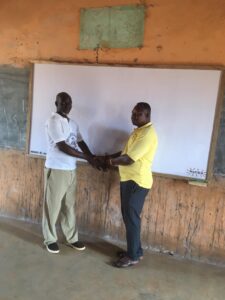 CoDA executive director donating boards to Kong-Daborin headmaster
